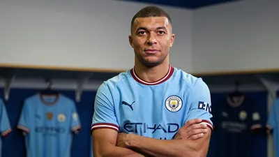 A 28-year-old Dutch midfielder in a solid blue Manchester City kit, standing with arms crossed, looking determined in a...