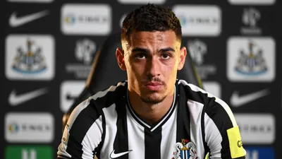 A close-up, waist-up shot of a 25-year-old, 5'11" athletic build, AC Milan forward turned Newcastle United target...