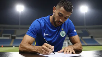 A muscular midfielder in a solid blue kit, waist-up shot, signing a contract with a Saudi Arabian club, pen poised over...
