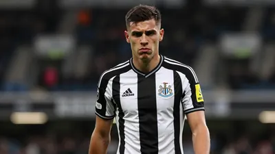 Mid-20s anonymous Newcastle United midfielder, short dark hair, intense eyes, slightly furrowed brow, wearing the...